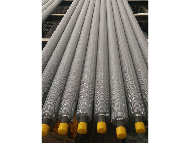 Extruded serrated finned tube