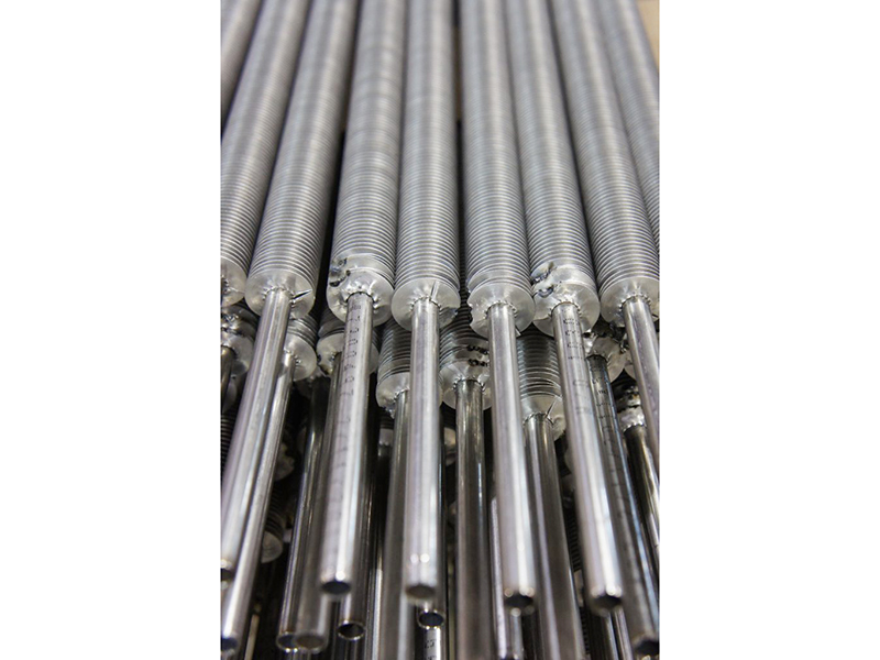 Spiral wound finned tubes